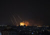 Ilustrasi: Asap mengepul menyusul serangan rudal Israel ke Kota Gaza pada 13 Mei 2021. (AP/Khalil Hamra via Times of Israel)