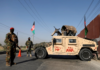 Perwira Tentara Nasional Afghanistan berjaga-jaga di sebuah pos pemeriksaan di Kabul pada 8 Juli 2021 [File: Reuters/Mohammad Ismail via Al Jazeera]